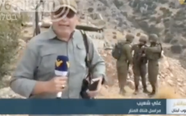 Ali Shoeib, a reporter for the Hezbollah affiliated Al-Manar TV network in Lebanon, reports live meters away from Israeli soldiers on the Lebanon border, September 19, 2022. (screenshot)