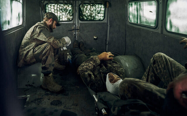 Wounded Ukrainian soldiers in a vehicle in the freed territory of the Kharkiv region, Ukraine, September 12, 2022. (AP Photo/Kostiantyn Liberov)