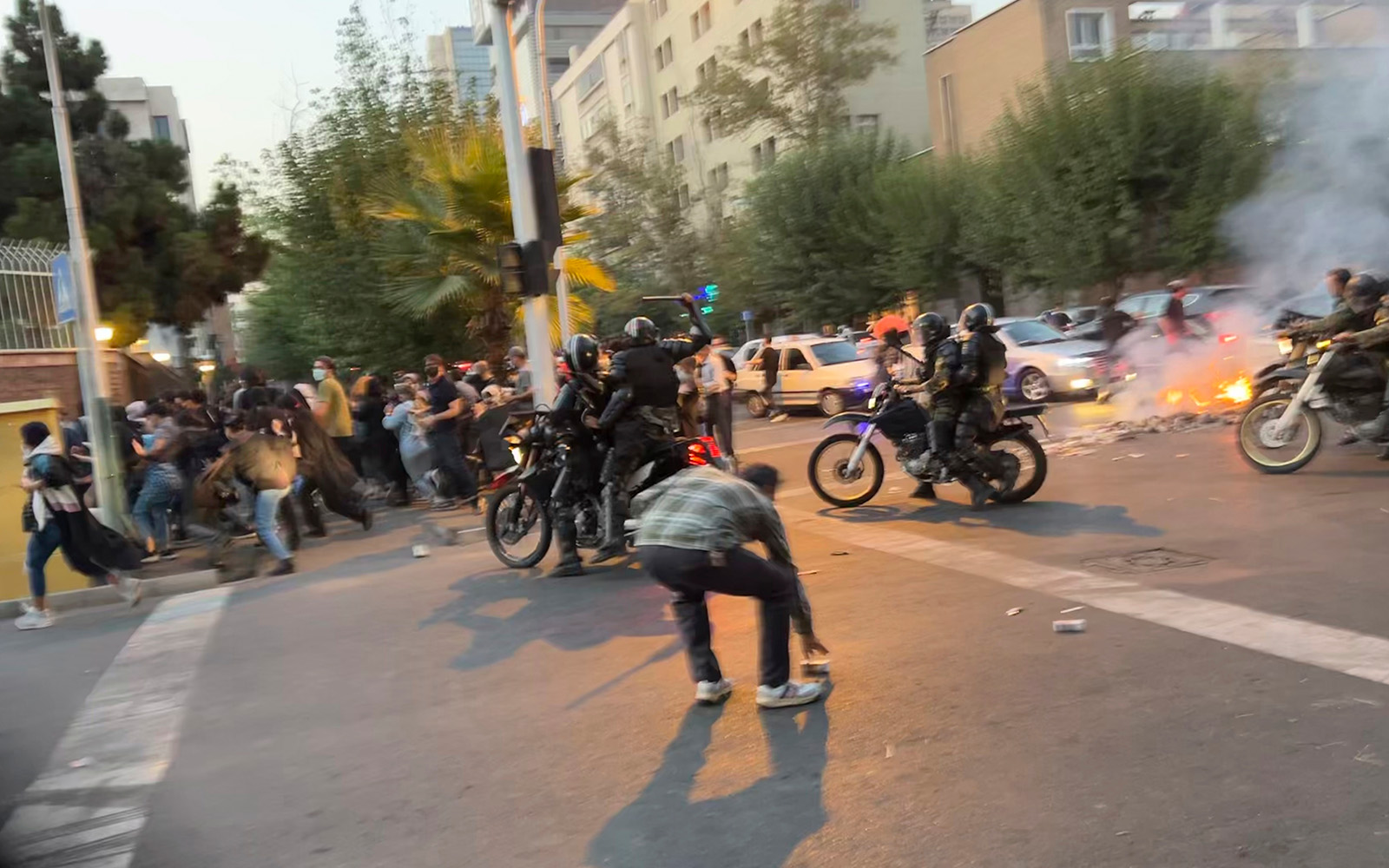 Anti-riot police arrive to disperse demonstrators during a protest over the death of a young woman who had been detained for violating the country’s conservative dress code, in downtown Tehran, Iran, September 19, 2022. (AP Photo)