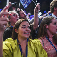 Supporters of the Sweden Democrats cheer during the Party's election night in Nacka, near Stockholm, after exit polls were released during the general elections in Sweden on September 11, 2022. (Jonathan Nackstrand/AFP)