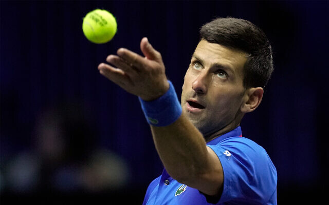 Novak Djokovic serves to Felix Auger-Allassime during their singles tennis match at the Laver Cup tennis tournament at the O2 arena in London, September 25, 2022. (AP Photo/Kin Cheung)