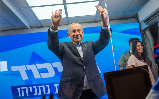 Likud leader Benjamin Netanyahu delivers an election campaign speech from inside a modified delivery truck with a side wall replaced with bulletproof glass, in the Kiryat Yovel neighborhood of Jerusalem, September 11, 2022. (Yonatan Sindel/Flash90)