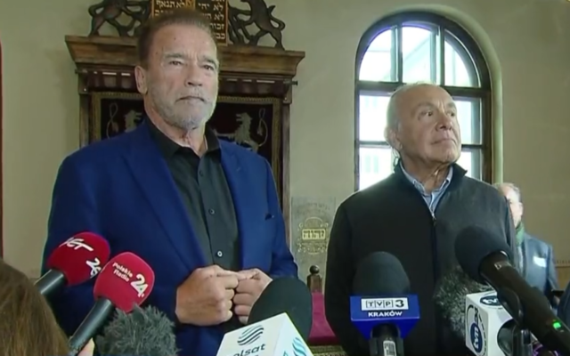 Former California governor and film icon Arnold Schwarzenegger addresses the media at the Auschwitz Jewish Center Foundation during his visit to the Auschwitz Nazi death camp, September 28, 2022. (Twitter)