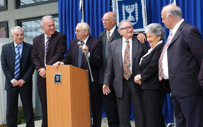 Members of the Pensioners party pose for photographs at the President's Residence in Jerusalem on April 3, 2006, a week after winning 7 seats in the general elections. Party leader Rafi Eitan is third from right (Guy Assayag/Flash90)