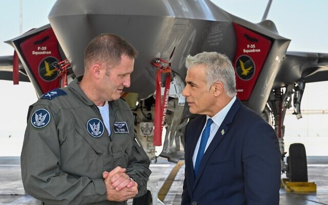 Prime Minister Yair Lapid (R) meets with Air Force Commander Tomer Bar at the Nevatim airbase in southern Israel, on September 6, 2022. (Kobi Gideon/PMO)