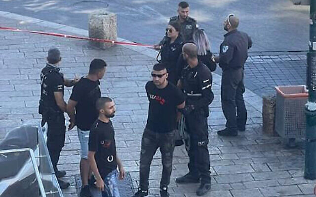 Police arrest an armed Palestinian man in Jaffa on September 8, 2022. (Courtesy)