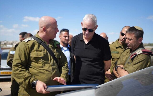 Defense Minister Benny Gantz tours the scene of a deadly gun battle near the Palestinian village of Jalamah in the northern West Bank, September 14, 2022. (Elad Malka/Defense Ministry)