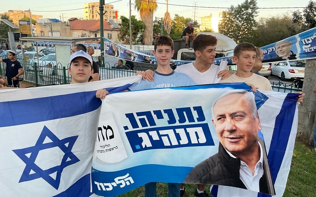 Shai, Gilad, and friends at a Ramat Gan election event for Likud party head Benjamin Netanyahu's "Bibi Ba" campaign bus, September 22, 2022 (Carrie Keller-Lynn/The Times of Israel)