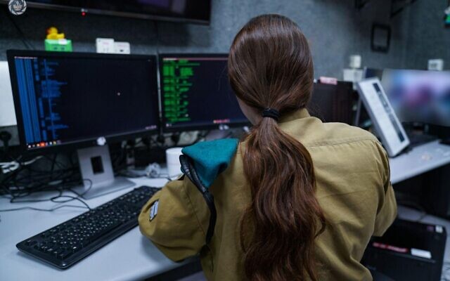 An Israeli soldier of the C4I Corps works at a computer, in an undated photo published by the military on September 21, 2022. (Israel Defense Forces)