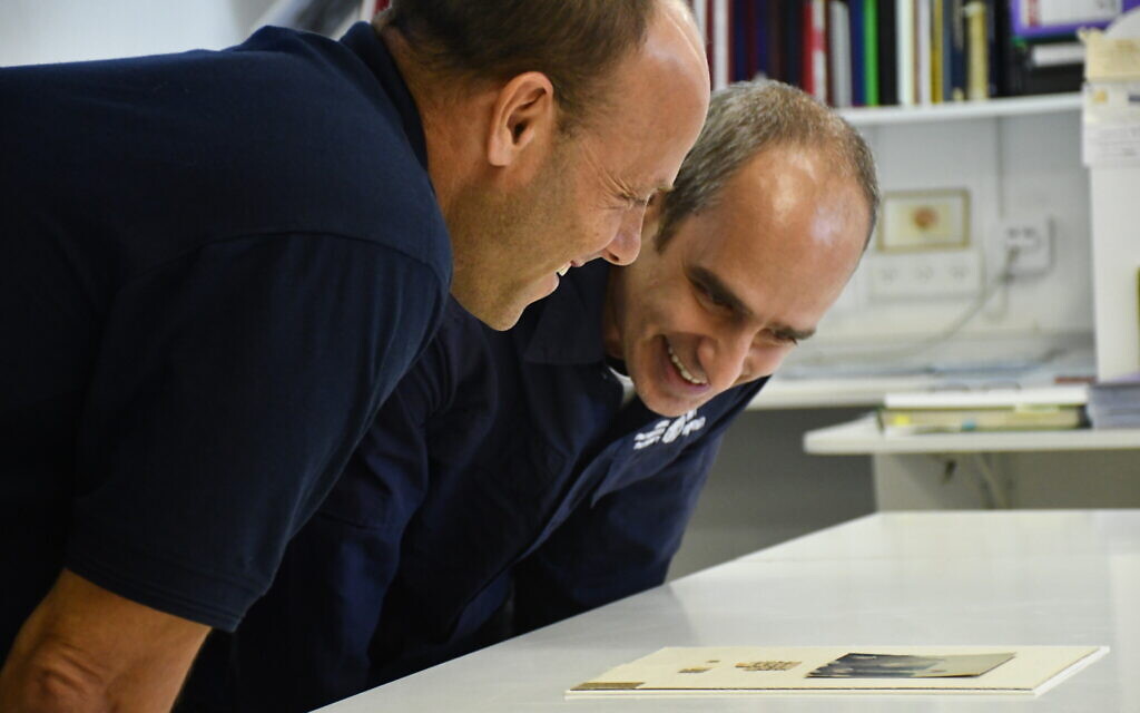 Dr. Joe Uziel (right) and Dr. Eitan Klein (left) of the Israel Antiquities Authority examining the rare find. (Yoli Scwhartz, Israel Antiquities Authority)