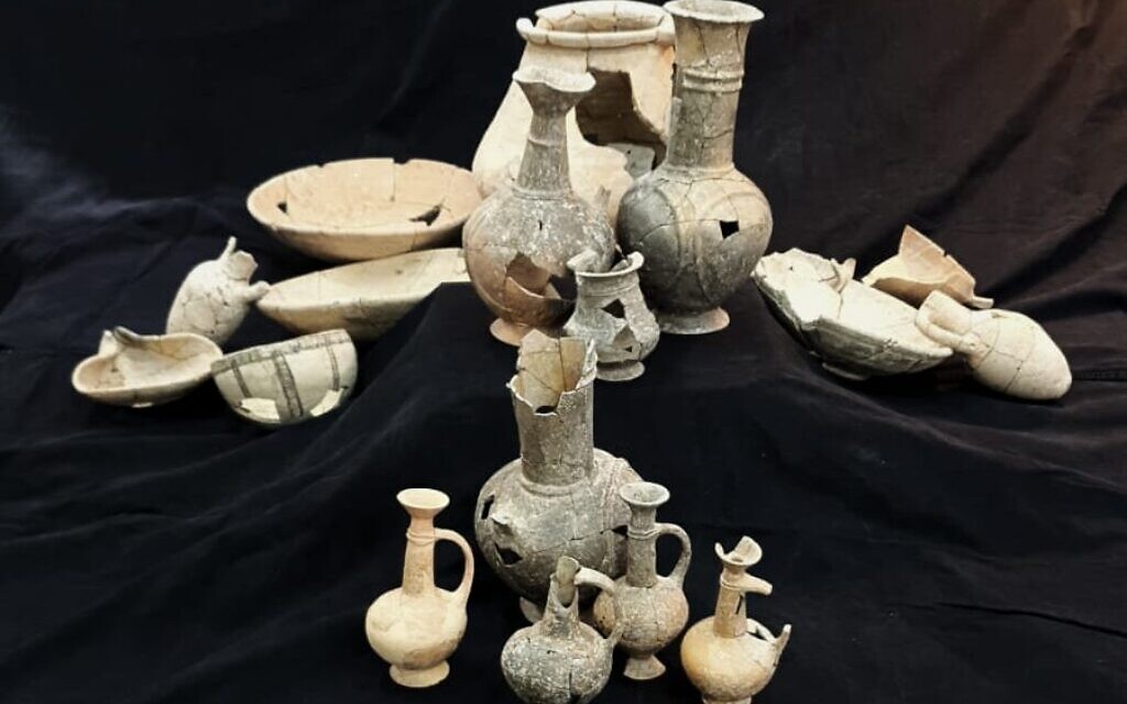 These 14th century BCE Cypriot jugs and juglets were laid on the deceased at Tel Yehud. Remains of opium were found in several of the vessels. (Shai Heksher, Israel Antiquities Authority)