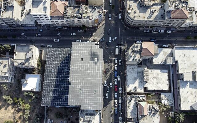 An aerial view of solar panels placed atop a bakery building used to power it, in Gaza City (MOHAMMED ABED / AFP)