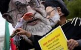 Demonstrators dressed as Iranian President Ebrahim Raisi and Iran's Supreme Leader Ali Khamenei rally outside the White House during a protest rally to condemn the murder of Mahsa Amini in Washington, DC, on September 24, 2022. (Stefani Reynolds/AFP)