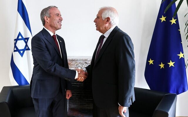 EU foreign policy chief Josep Borrell (R) shakes hands with Intelligence Minister Elazar Stern before an EU-Israel Association Council at the European Council in Brussels, on October 3, 2022. (Kenzo TRIBOUILLARD / AFP)
