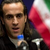 Iranian soccer star Mohammad Ali Karimi, then a nominee of AFC Player Of The Year, speaks at a press conference in the Malasian capital Kuala Lumpur, November 28, 2012. (Saeed KHAN / AFP)