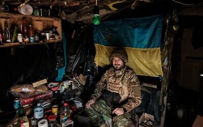A soldier of Ukraine's 5th Regiment of Assault Infantry sits in their bunker at a front line near Toretsk in the Donetsk region on October 12, 2022, amid the Russian invasion of Ukraine. (Yasuyoshi Chiba/AFP)