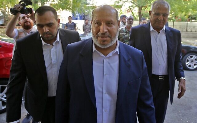 Hamas's chief representative in Lebanon Osama Hamdan, left, Hamas arab relations chief Khalil al-Hayya, center, and secretary general of the Popular Front for the Liberation of Palestine, Talal Naji, arrive for a press conference during a visit to the Syrian capital Damascus on October 19, 2022. (Louai Beshara / AFP)