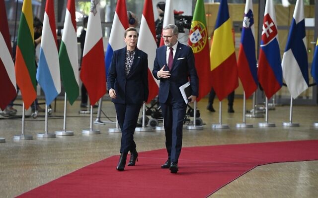 Denmark's Prime Minister Mette Frederiksen (L) and Czech Republic's Prime Minister Petr Fiala arrive for the first day of a EU leaders Summit at The European Council Building in Brussels on October 20, 2022. (John Thys/AFP)