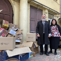 Rabbi Mordechai Bald and his wife, Sara, have distributed thousands of boxes of supplies to Jewish refugees from around Ukraine in Lviv – boxes of empty products that they have given out lie around outside the synagogue. (Jacob Judah/ JTA)
