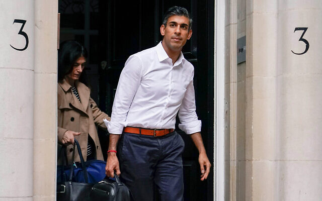Conservative Party leadership candidate Rishi Sunak leaves his campaign office, in London, October 23, 2022. (AP Photo/Alberto Pezzali)
