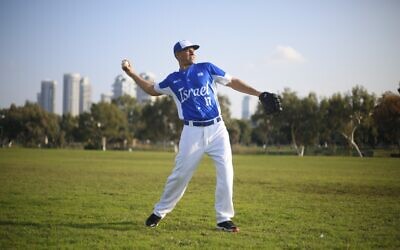In this Tuesday, Jan. 14, 2020 photo, Danny Valencia throws a ball during Israel's national baseball team practice, in Tel Aviv (AP Photo/Ariel Schalit)