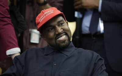 File - Rapper Kanye West wears a Make America Great Again hat during a meeting with then-US president Donald Trump in the Oval Office of the White House in Washington on October 11, 2018. (AP Photo/Evan Vucci, File)