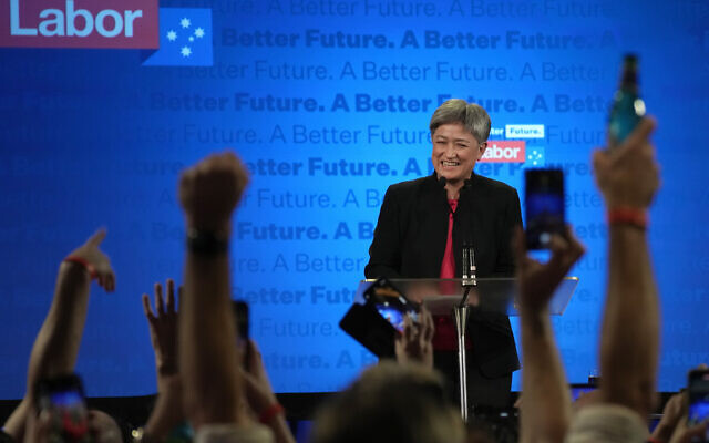 Labor Party senator Penny Wong smiles as she introduces party leader Anthony Albanese at an event in Sydney, Australia, Sunday, May 22, 2022, after Prime Minister Scott Morrison conceding defeat to Albanese in a federal election. (AP/Rick Rycroft)