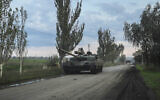 Ukrainian servicemen drive a tank on the way to Siversk, Donetsk region, Ukraine, October 1, 2022. (Inna Varenytsia/AP)