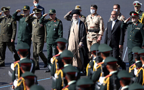 In this picture released by the official website of the office of the Iranian supreme leader, Supreme Leader Ayatollah Ali Khamenei, center, reviews a group of armed forces cadets during their graduation ceremony accompanied by commanders of the armed forces, at the police academy in Tehran, Iran, October 3, 2022. (Office of the Iranian Supreme Leader via AP)