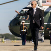 US President Joe Biden boards Air Force One at Andrews Air Force Base, Maryland, on Oct. 6, 2022, to travel to Poughkeepsie, N.Y. (AP Photo/Andrew Harnik)