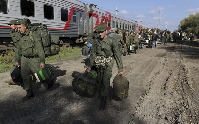 Russian recruits walk to take a train at a railway station in Prudboi, Volgograd region of Russia, Thursday, September 29, 2022. (AP Photo, File)