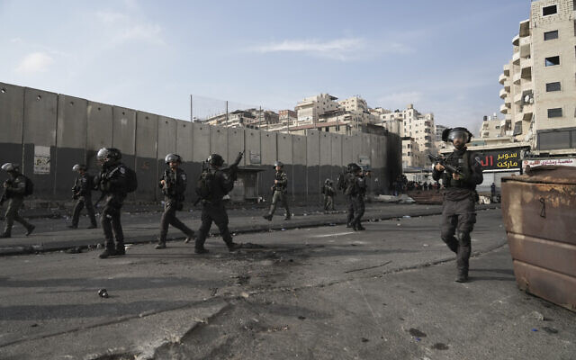 Israeli police clash with Palestinians in the Shuafat refugee camp in East Jerusalem, October 12. 2022. (AP Photo/Mahmoud Illean)