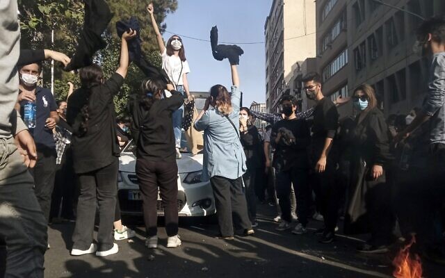 Iranians protest the death of Mahsa Amini after she was detained by the morality police, in Tehran, October 1, 2022. (A photo taken by an individual not employed by the Associated Press and obtained by the AP outside Iran/ Middle East Images)