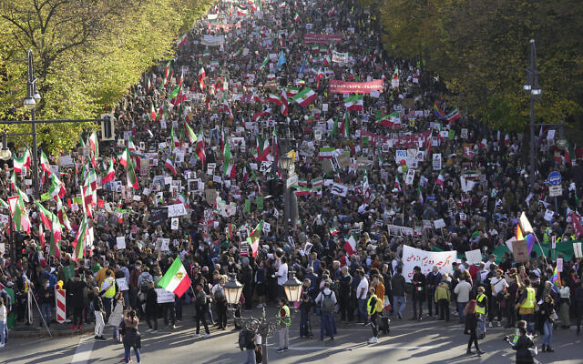 People attend a protest against the Iranian regime, in Berlin, Germany, October 22, 2022, following the death of Mahsa Amini in the custody of the Islamic Republic's notorious "morality police". (AP Photo/Markus Schreiber)