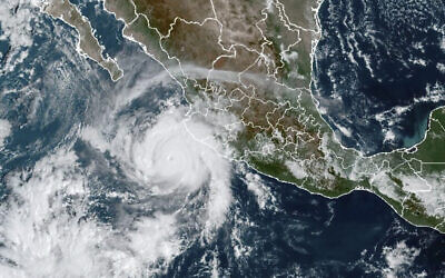 This satellite image taken at 15:30 UTC and provided by NOAA shows Hurricane Roslyn approaching the Pacific coast of Mexico, October 22, 2022. (NOAA via AP)