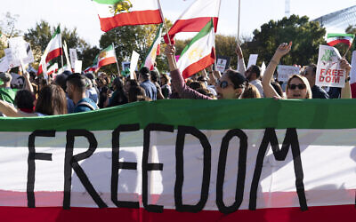 US demonstrators rally at the National Mall to protest against the Iranian regime, in Washington, DC, October 22, 2022, following the death of Mahsa Amini in the custody of the Islamic Republic's notorious "morality police." (AP Photo/Jose Luis Magana)
