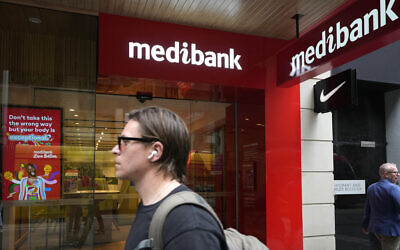 A man walks past a Medibank branch in Sydney, October 26, 2022. (Rick Rycroft/AP)