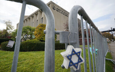 A Star of David hangs from a fence outside the dormant landmark Tree of Life synagogue in Pittsburgh's Squirrel Hill neighborhood on October 26, 2022. (Gene J. Puskar/AP)