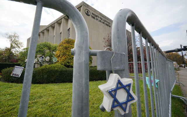 A Star of David hangs from a fence outside the dormant landmark Tree of Life synagogue in Pittsburgh’s Squirrel Hill neighborhood on October 26, 2022. (Gene J. Puskar/AP)