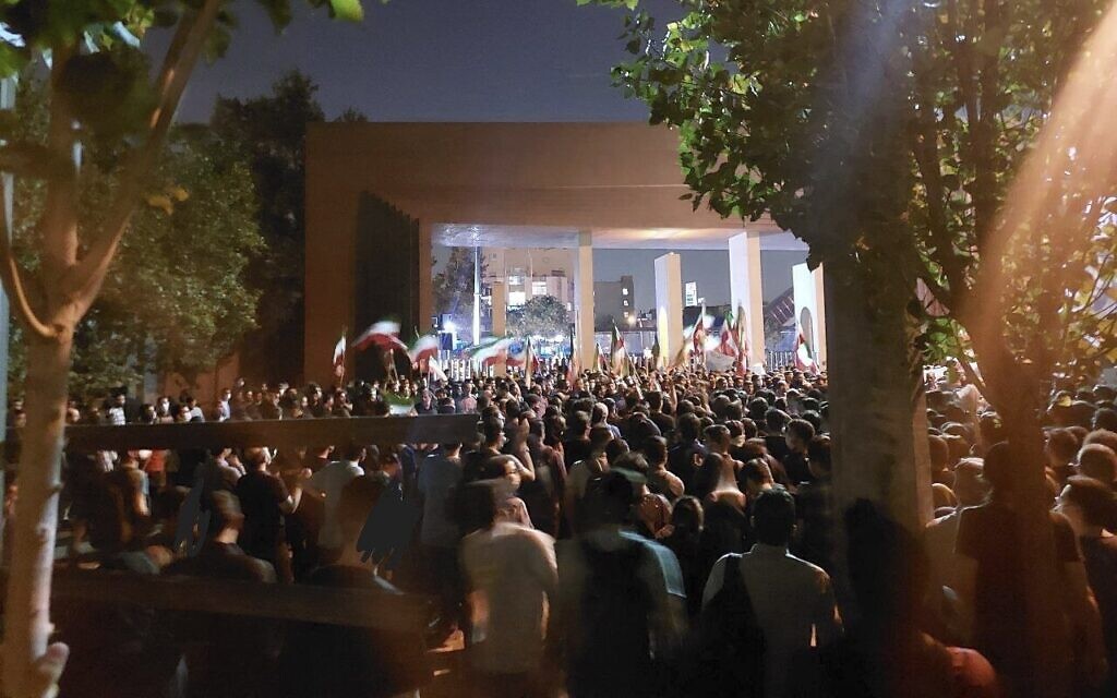 In this photo taken by an individual not employed by the Associated Press and obtained by the AP outside Iran, students of Sharif University of Technology attend a protest sparked by the death of 22-year-old Mahsa Amini in the custody of the country's morality police, in Tehran, October 7, 2022. (AP Photo)