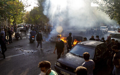 Iranians protest the death of Mahsa Amini in Tehran, October 27, 2022. (This photo was taken by an individual not employed by The Associated Press and obtained by the AP outside Iran)