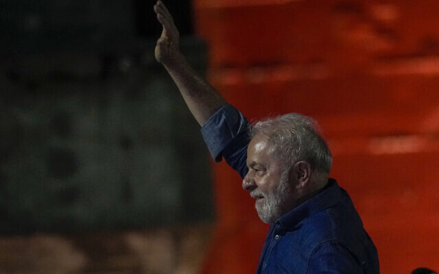 Former Brazilian president Luiz Inacio Lula waves to supporters gathered on Paulista Av. after he defeated incumbent Jair Bolsonaro in a presidential run-off election to become the country's next president, in Sao Paulo, Brazil, October 30, 2022. (AP Photo/Andre Penner)