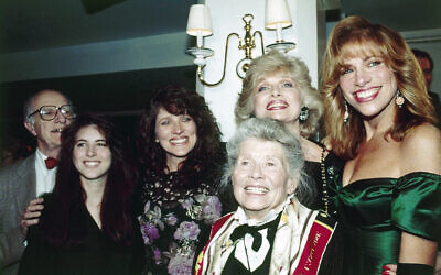 Singer Carly Simon, right, is joined by her sisters and mother at a party in New York on Thursday, March 23, 1990, to celebrate the release of her new album My Romance. From left are Lucy, Andrea, Joanna and Carly Simon. (AP/Ed Bailey)