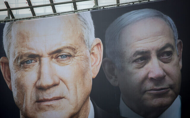 Election posters hung by the Blue and White party show its candidate Benny Gantz and Prime Minister Benjamin Netanyahu with a Hebrew slogan reading 'Netanyahu cares only for himself,' ahead of the 2020 elections. (Miriam Alster/ FLASH90/ File)