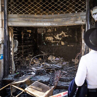 View of a cellular shop that was allegedly set on fire early Sunday, in the ultra-Orthodox Geula neighborhood in Jerusalem, October 2, 2022. (Yonathan Sindel/Flash90)