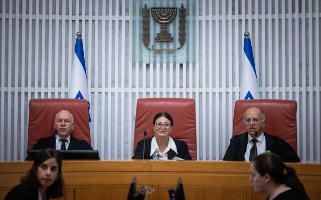 Supreme Court Chief Justice Ester Hayut (C) and fellow justices arrive for a hearing on the Central Elections Committee decision to disqualify Balad from running in the upcoming Knesset election, October 6, 2022. (Jonatan Sindel/Flash90)