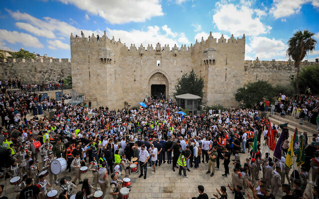 Hundreds of Palestinian Muslims celebrate the Prophet Muhammad's birthday with a procession in Jerusalem's Old City, October 8, 2022. (Jamal Awad/Flash90)
