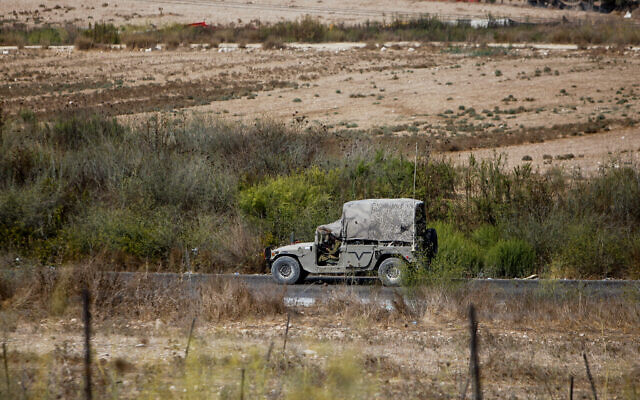 Illustrative: Israeli soldiers are seen near the scene of a shooting attack, near the West Bank settlement of Shavei Shomron, on October 11, 2022. (Nasser Ishtayeh/Flash90)