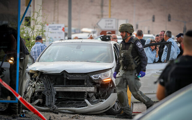 Israeli security forces at the scene of a vehicle-ramming attack at the Almog Junction in the West Bank, October 30, 2022. (Jamal Awad/Flash90)