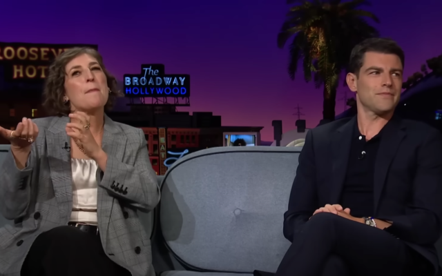 Mayim Bialik (left) and Max Greenfield demonstrate the sounds and calls of the Rosh Hashanah shofar blowing on James Corden's 'Late Late Show' on September 29, 2022 (Courtesy YouTube screengrab)